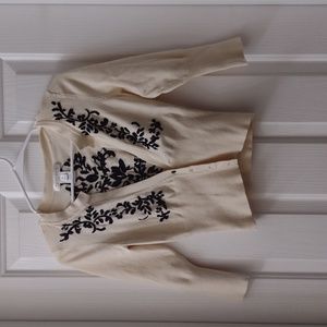 White House Black Market Cream Sweater with black floral embellishments